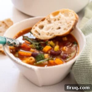 Authentic Italian Minestrone 10 A bowl of minestrone with a piece of Italian bread.