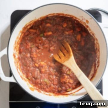 Authentic Italian Minestrone 6 Simmering crushed tomatoes with vegetables.