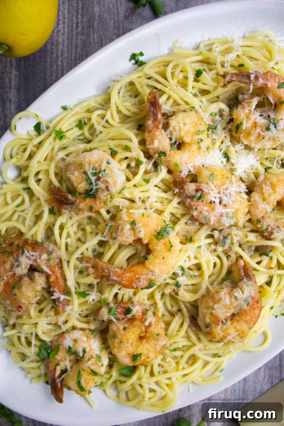 Wine-Free Shrimp Scampi 3 shrimp scampi over spaghetti garnished with parsley