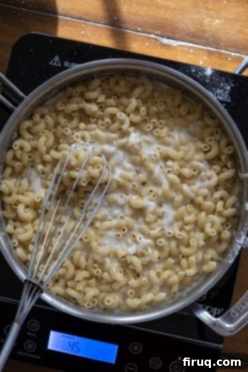 Authentic Italian Macaroni and Cheese 7 macaroni added to cheese mixture