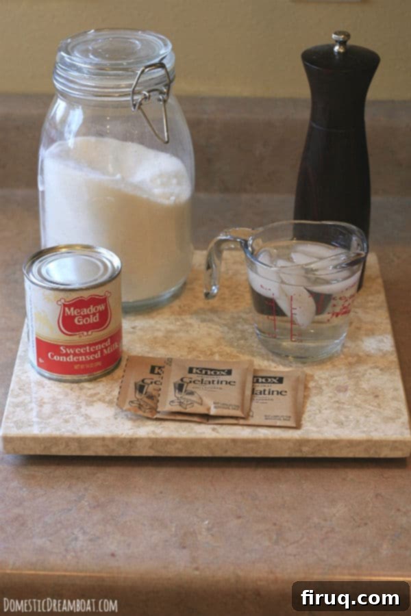 Ingredients for Sweetened Condensed Milk Marshmallows A photo showing some of the key ingredients needed to make sweetened condensed milk marshmallows: granulated sugar, a pinch of salt, a can of sweetened condensed milk, a bowl of ice water, and gelatin packets.
