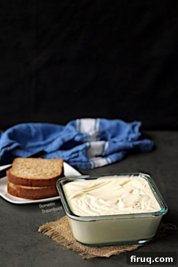 Freshly prepared spreadable butter in a glass container, ready to use. Homemade spreadable butter in glass container