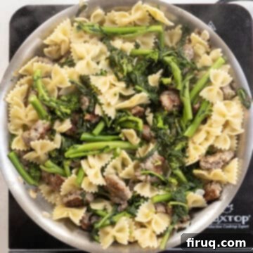 Sausage and Rapini Pasta 11 Farfalle added to the pan with broccoli rabe and sausage.
