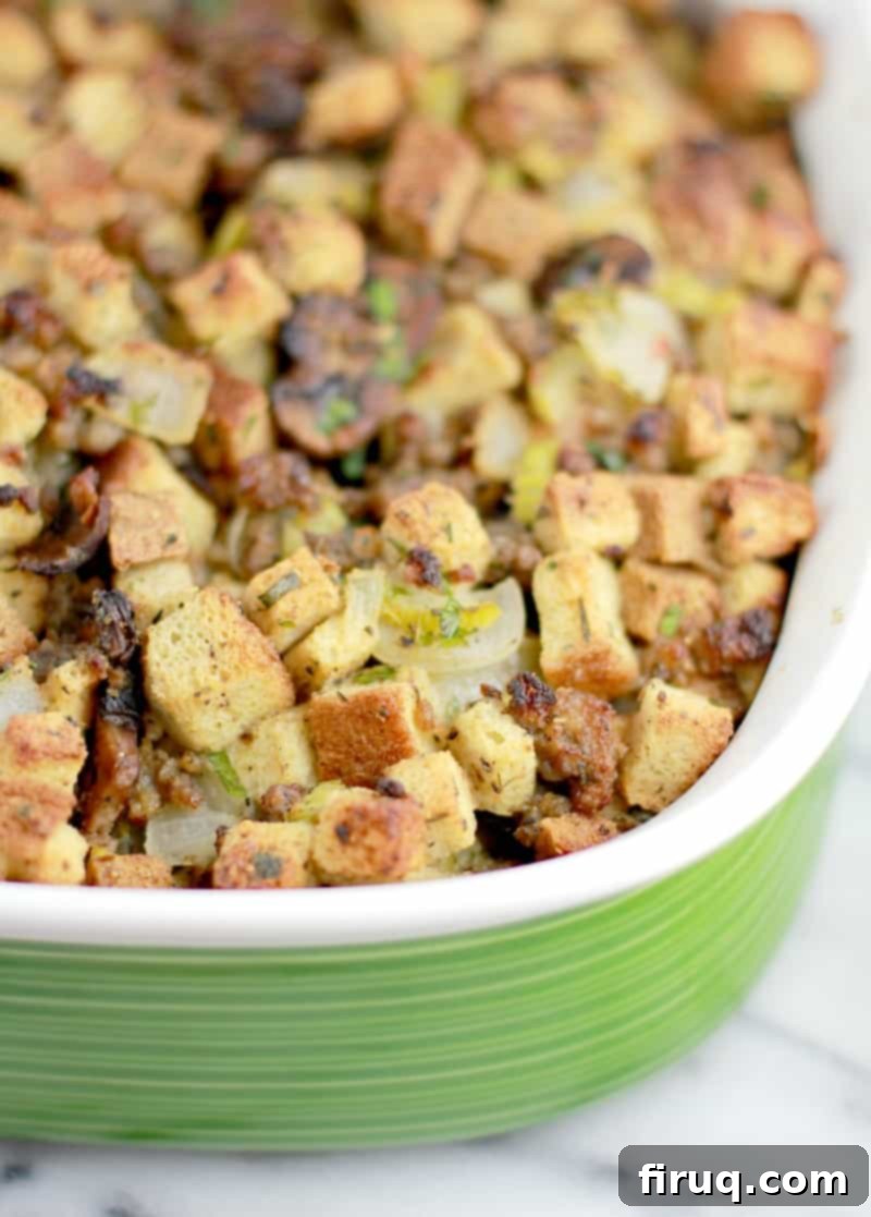 The Ultimate Holiday Stuffing 2 Angle down view of the finished stuffing in a green bake dish, perfectly golden brown
