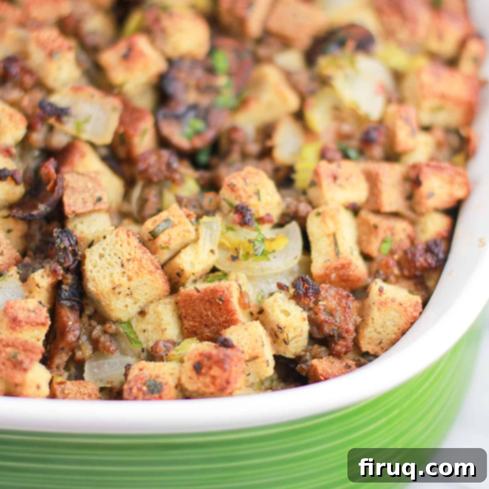 The Ultimate Holiday Stuffing 16 A delicious, golden-brown stuffing in a casserole dish, ready to be served for holiday gatherings.