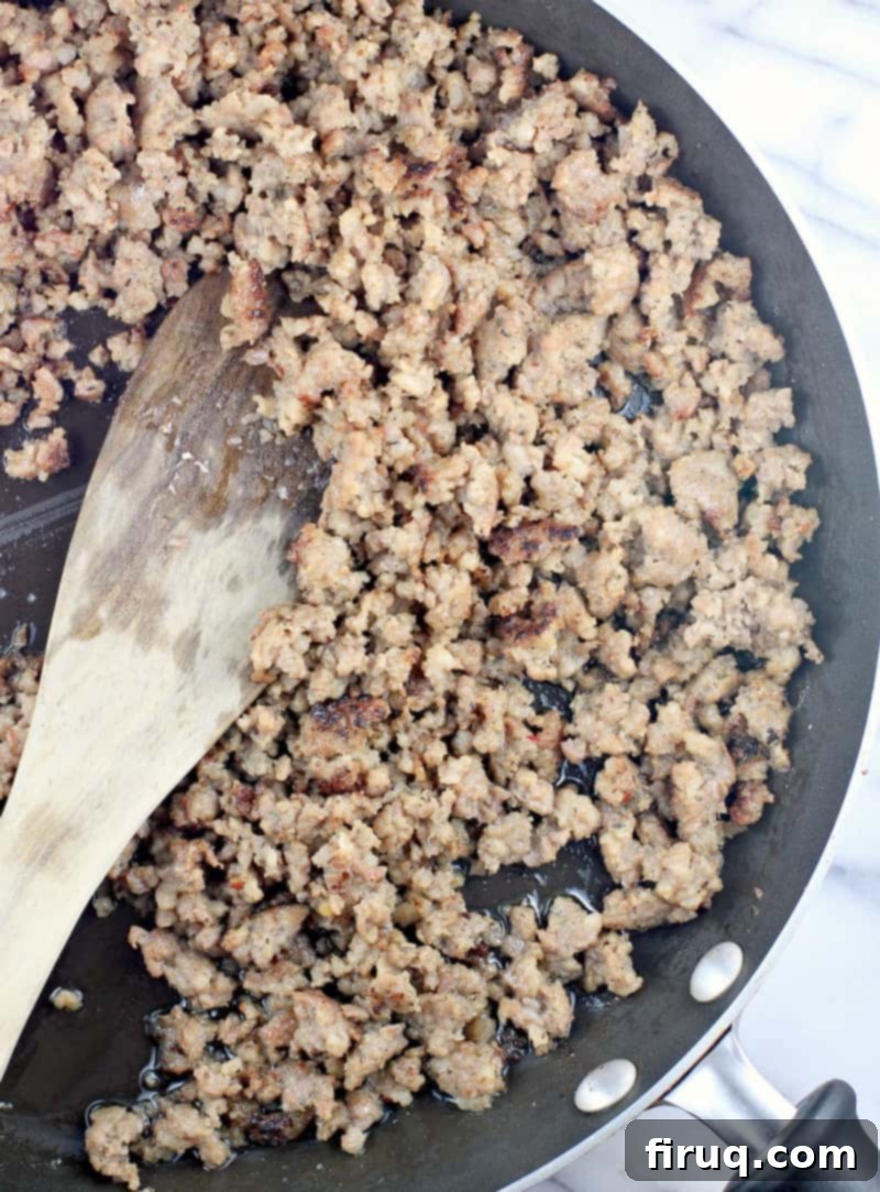The Ultimate Holiday Stuffing 4 Cooked sage sausage crumbled in a skillet, ready for the stuffing recipe