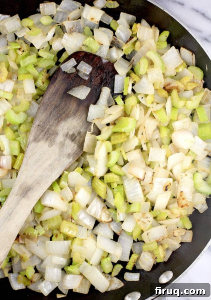 The Ultimate Holiday Stuffing 5 Diced onion and sliced celery cooking in a skillet, softened and aromatic