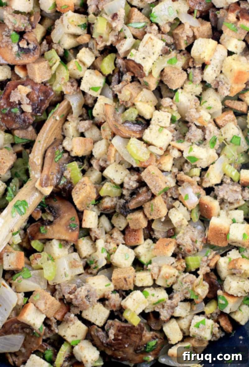 The Ultimate Holiday Stuffing 9 Top-down view of the assembled sausage stuffing recipe in a baking dish, before it goes into the oven