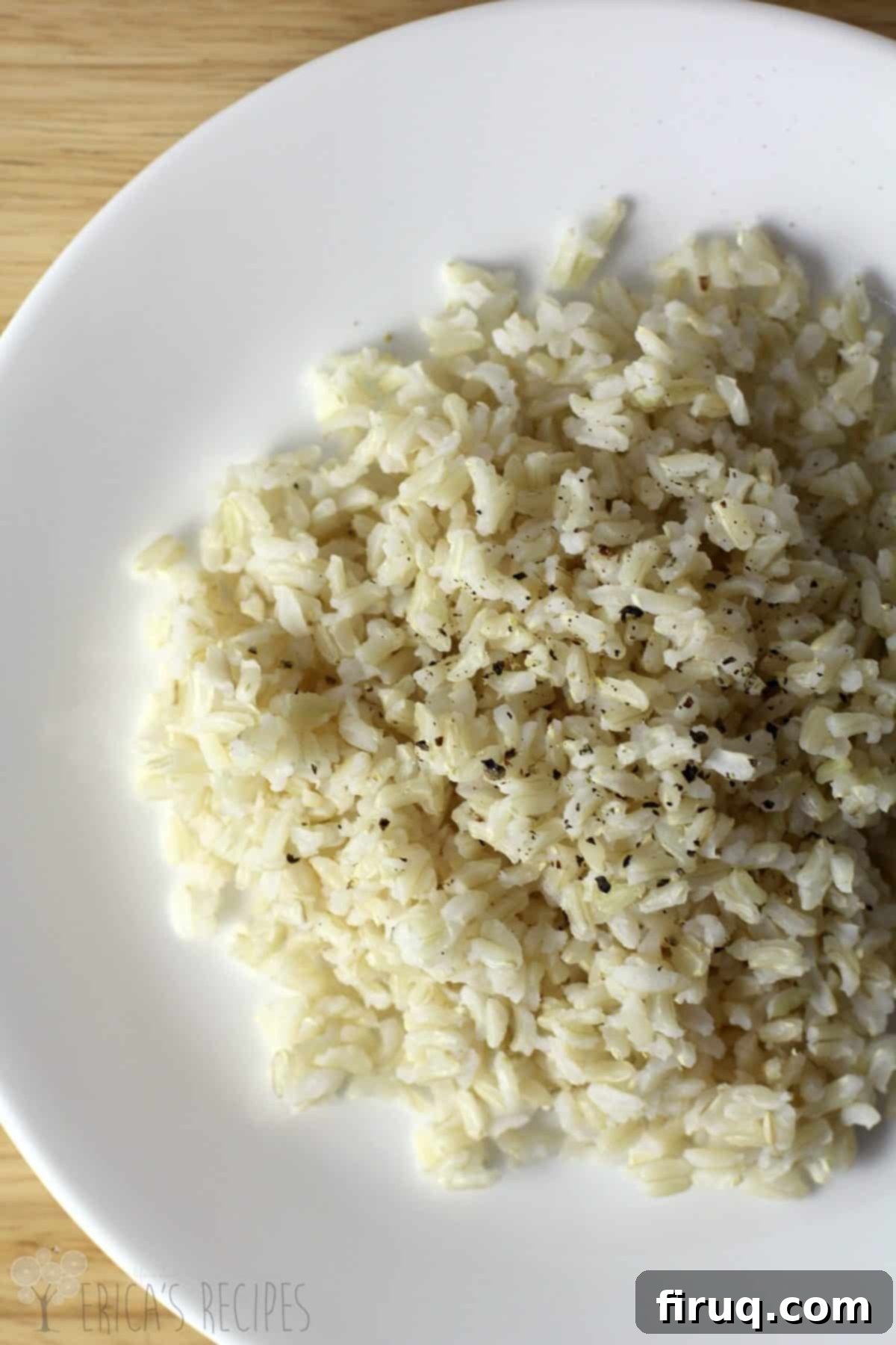Fluffy Brown Rice Every Time 4 A small bowl of fluffy, perfectly cooked brown rice garnished with fresh herbs, ready to be served.