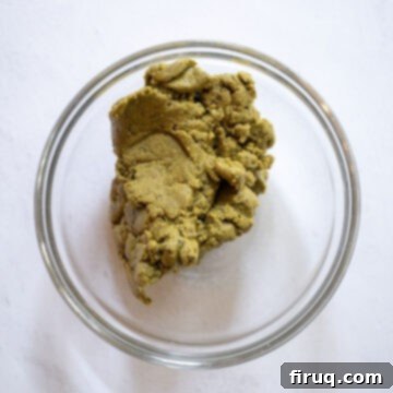 Emerald Dream Tiramisu 5 A bowl of vibrant green homemade pistachio butter.
