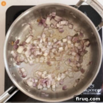 Creamy Vodka Chicken Pizza 7 Sauteing shallots in the saucepan.