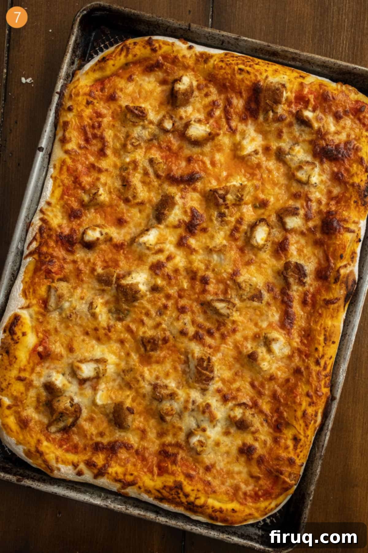Creamy Vodka Chicken Pizza 10 Pizza cooked on a cutting board.