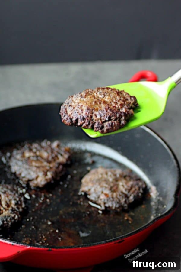 Perfectly Cooked Blended Burger Cooked hamburger patty on a spatula, showing the texture of a blended burger