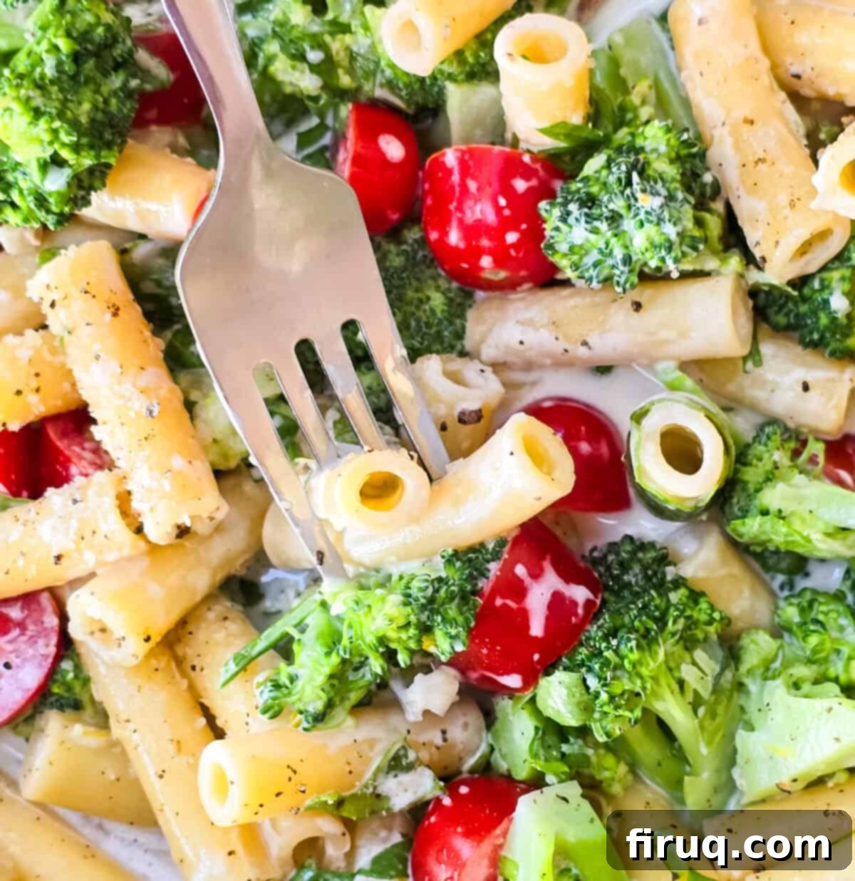 Lemony Creamy Pasta with Fresh Arugula and Broccoli 4 fork inserted into prepared arugula and broccoli pasta