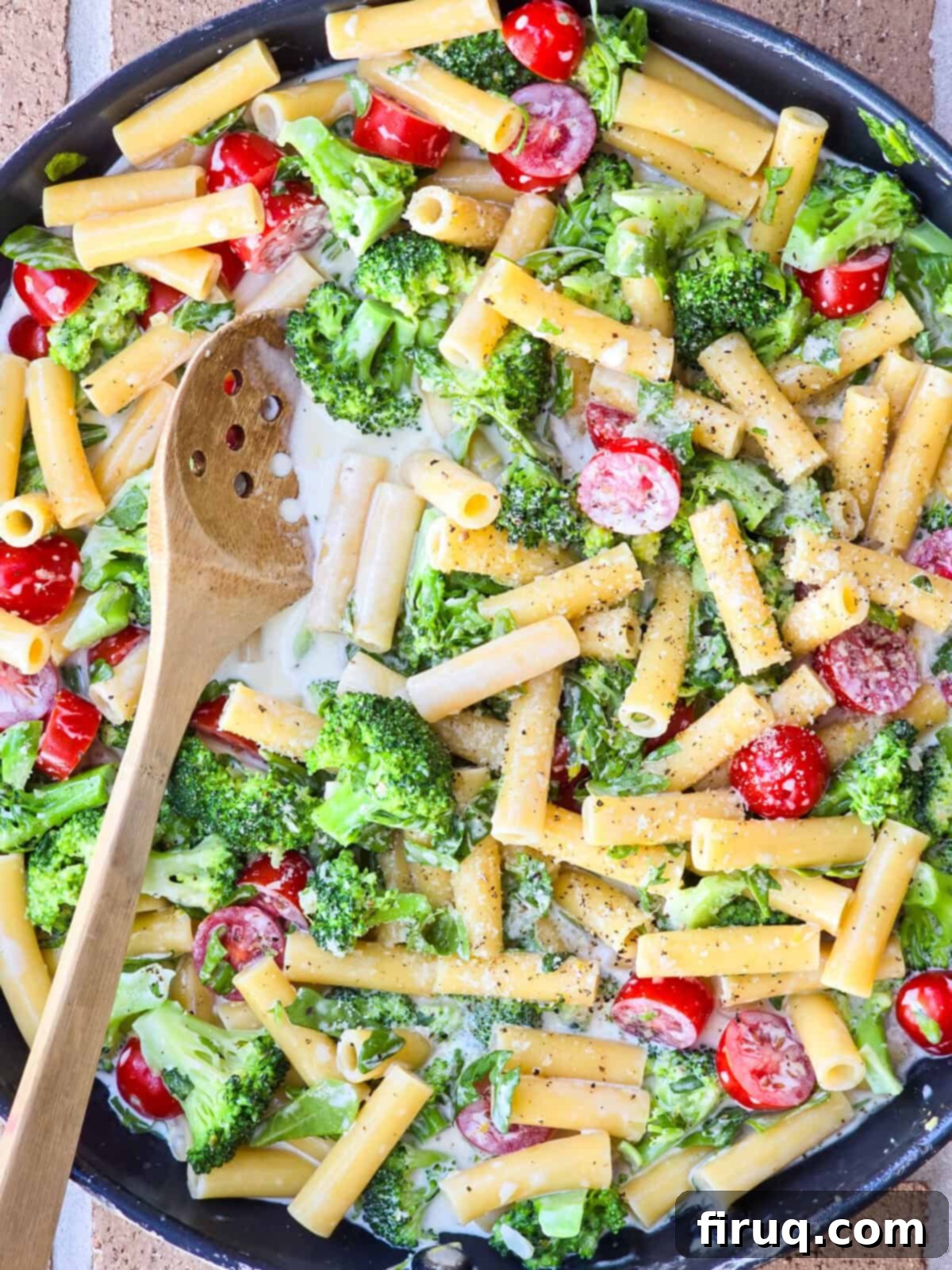 Lemony Creamy Pasta with Fresh Arugula and Broccoli 5 prepared lemon pasta in large skillet with wood spoon