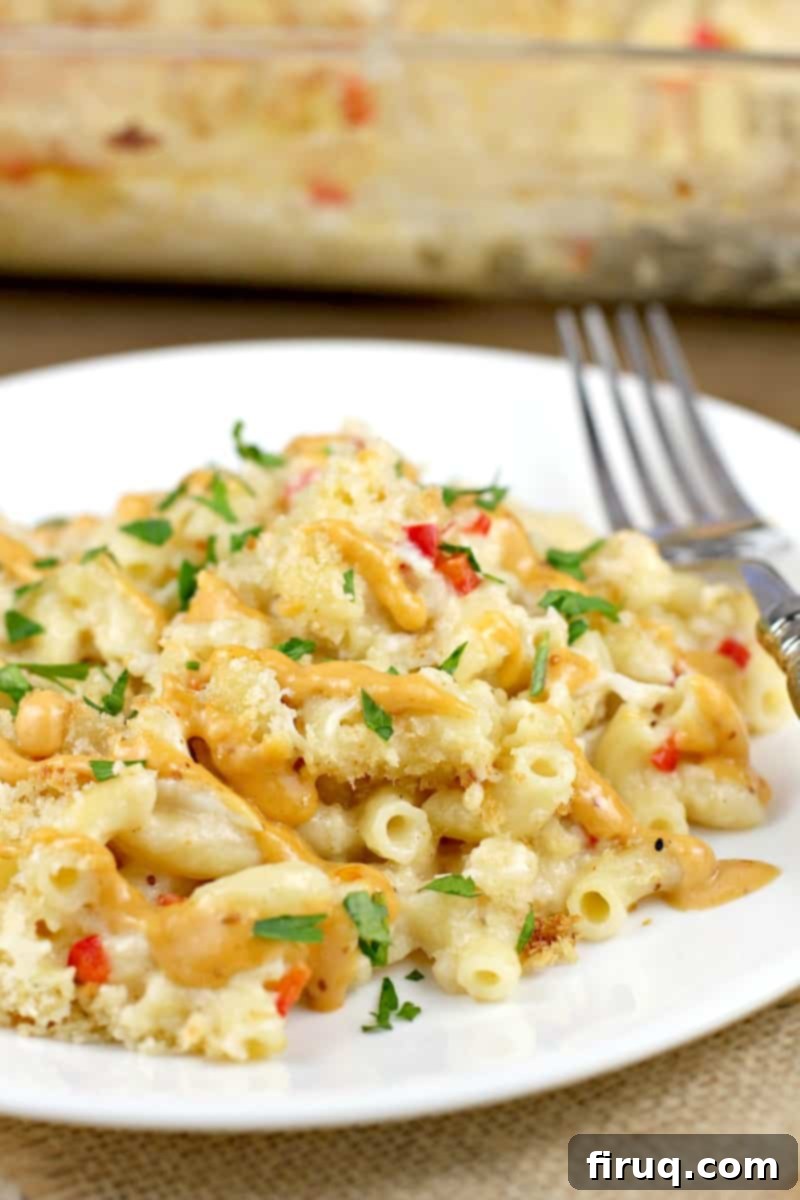 Decadent Crab Mac and Cheese 2 crab mac and cheese on white plate with fork