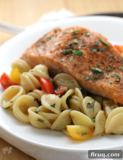 Effortless Salmon with Fresh Tomato Orecchiette 3 Ingredients for baked salmon and raw tomato orecchiette sauce laid out on a wooden board