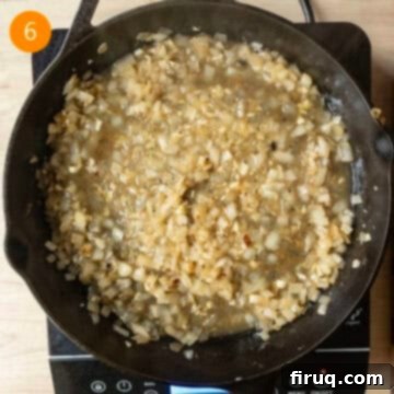 One-Pan Cast Iron Lemon Chicken Orzo 6 Simmering the onions and garlic with wine.