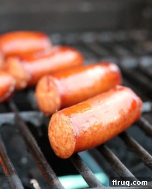 Beer-Glazed Kielbasa and Sausage with Stout Queso 7 juicy beer brats cooking on the grill