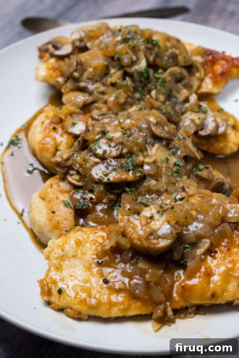 Rich Marsala Chicken with Sautéed Mushrooms 2 Restaurant-style chicken marsala served family style, garnished with fresh parsley.