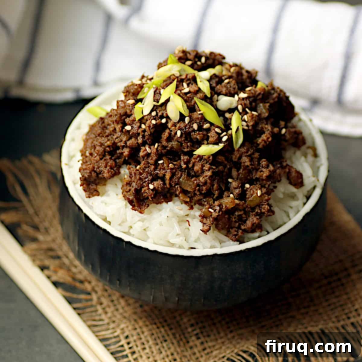 Effortless Korean Beef and Mushroom Bowls 2 Korean beef and mushrooms over rice in a black bowl.