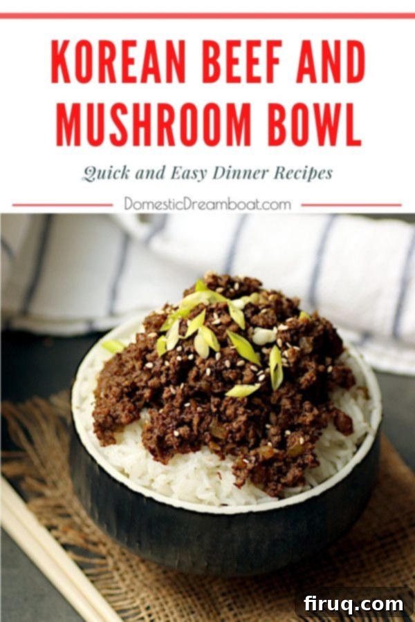 Final Korean Beef and Mushroom Bowl A black bowl filled with Korean beef and mushroom over rice, garnished with fresh greens and sesame seeds, ready to be eaten.