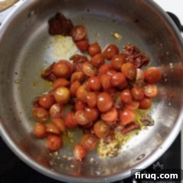 Robust Red Clam Linguine 6 Bright red cherry tomatoes added to the saucepan with the garlic and caramelized tomato paste.