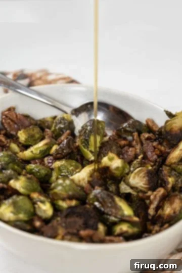 Roasted Maple Bacon Brussels Sprouts 9 maple syrup poured on cooked brussel sprouts