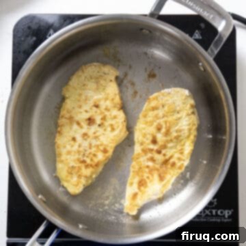 Ultimate Chicken Pizzaiola 6 Chicken breast sizzling and frying to a golden brown in a large saucepan with olive oil.
