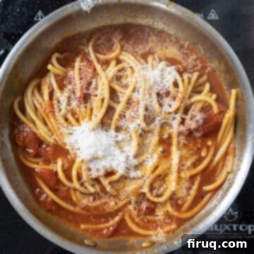 Bucatini Amatriciana 11 Finished Bucatini Amatriciana, freshly combined with sauce and Pecorino, topped with crispy guanciale, ready to serve.