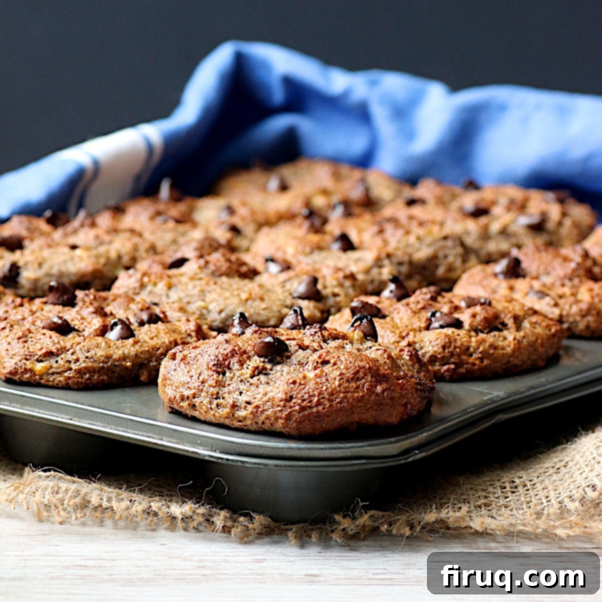 Banana Chocolate Chip Bran Muffins Banana Chocolate chip muffins in a muffin pan.