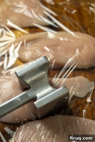 Elevated Chicken Saltimbocca 3 tenderizing chicken breast with a meat mallet