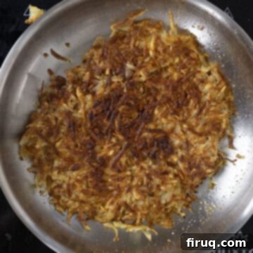 Your Italian Breakfast Sandwich 8 Hashbrowns flipped in the pan, cooking the second side to perfection.