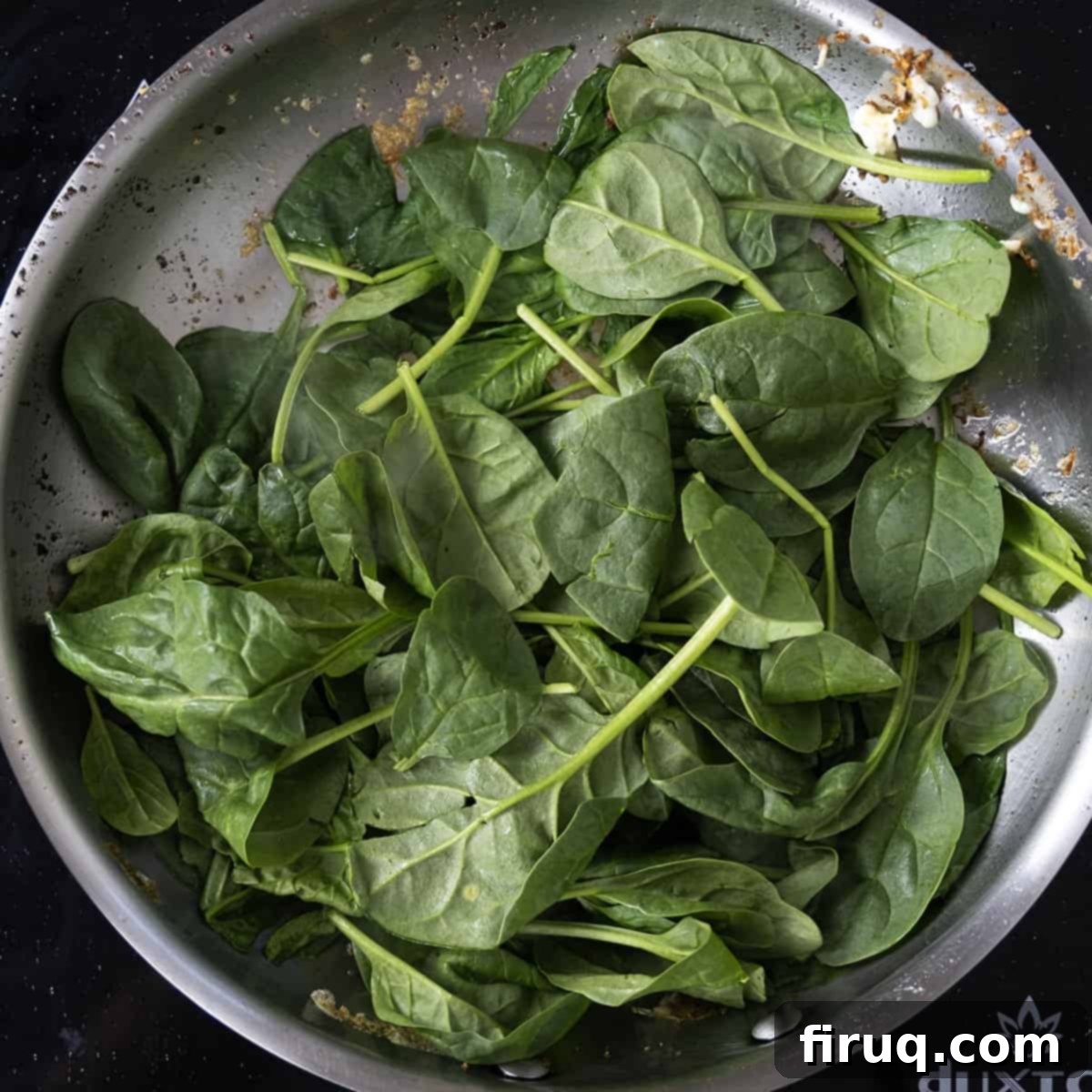 Your Italian Breakfast Sandwich 9 Sauteing fresh spinach with garlic in a pan.