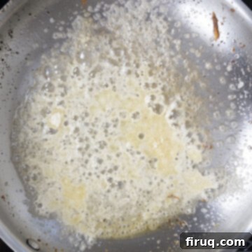 Your Italian Breakfast Sandwich 10 Grated parmesan cheese melting in a hot pan before adding eggs.