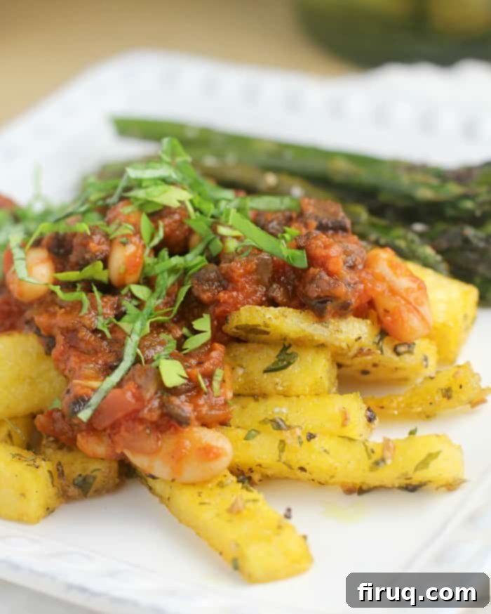 Bolognese Meets Golden Polenta Fries 2 Image of a bowl of Quick Bolognese over Polenta Fries, as presented in the recipe card.