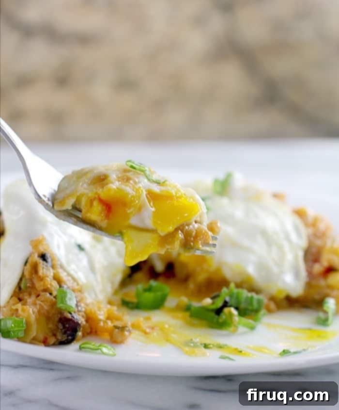 Set-It-And-Forget-It Quinoa Tamale Casserole 7 fork holding a bite sized amount of casserole with egg
