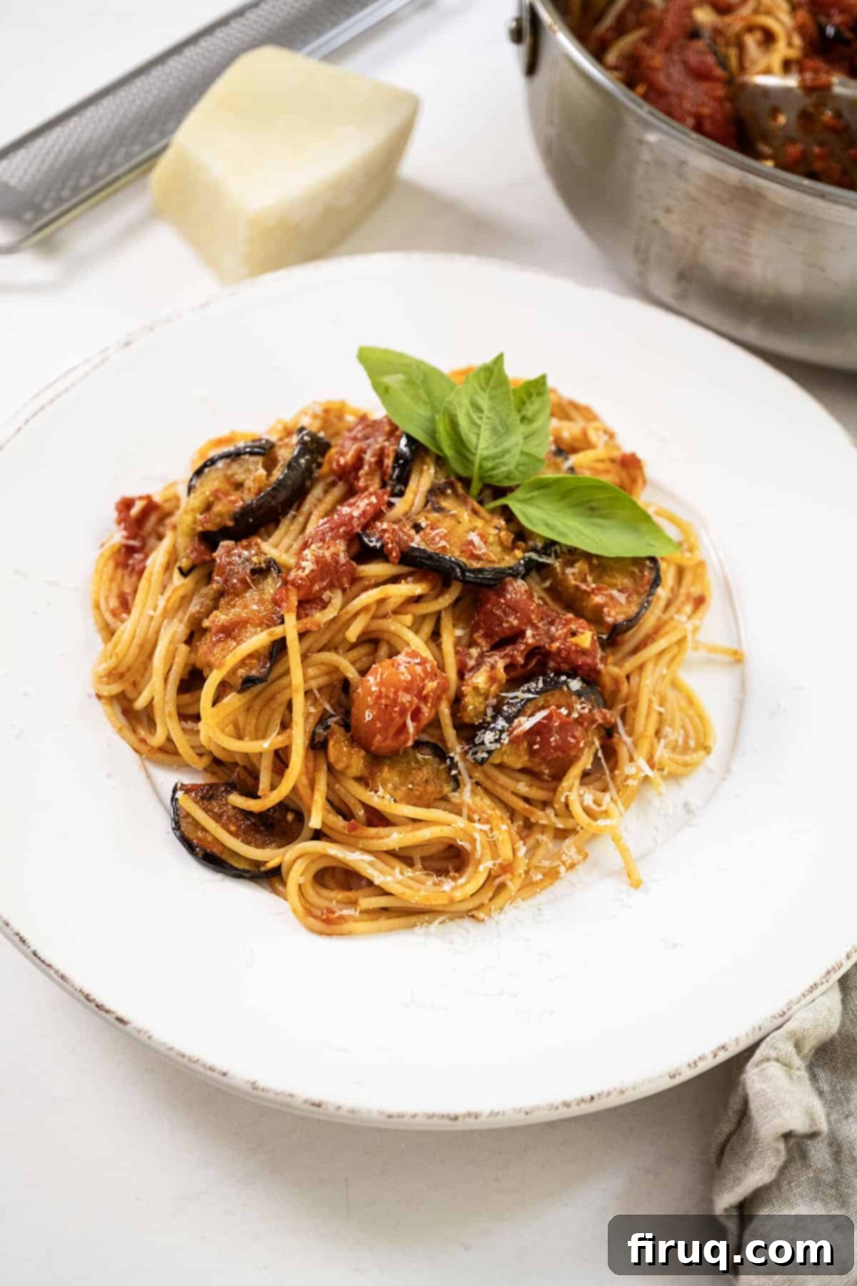 Pasta alla Norma: Sicilian Classic 11 Pasta alla norma plated on a dish and garnished with basil.