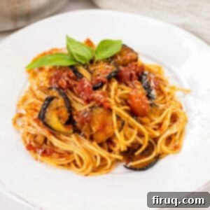 Pasta alla Norma: Sicilian Classic 12 Pasta alla norma plated on a dish and garnished with basil.