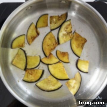 Pasta alla Norma: Sicilian Classic 5 Frying eggplant in a sauce pan.