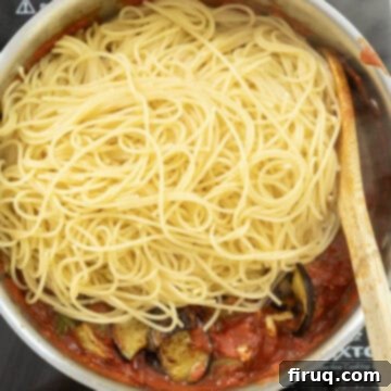 Pasta alla Norma: Sicilian Classic 10 Spaghetti added to the sauce.