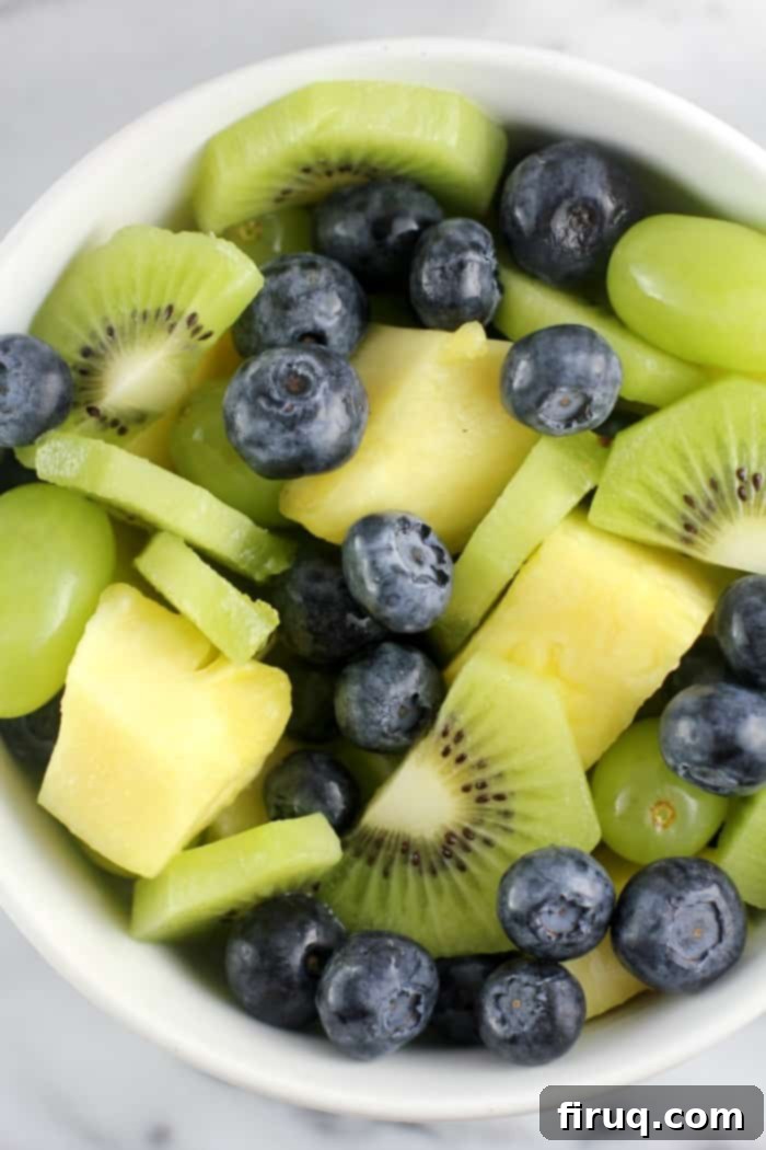 Refreshing Key Lime Parfait with Crispy GrainFree Granola 6 Assorted fresh fruit including kiwi, pineapple, blueberries, and green grapes for the parfait