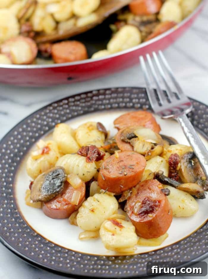 Cajun Smoked Sausage Gnocchi in 20 Minutes 9 A top-down shot of Cajun Smoked Sausage and Gnocchi in a bowl, ready to be served, highlighting the delicious textures and vibrant colors. #EverydayEckrich #ad