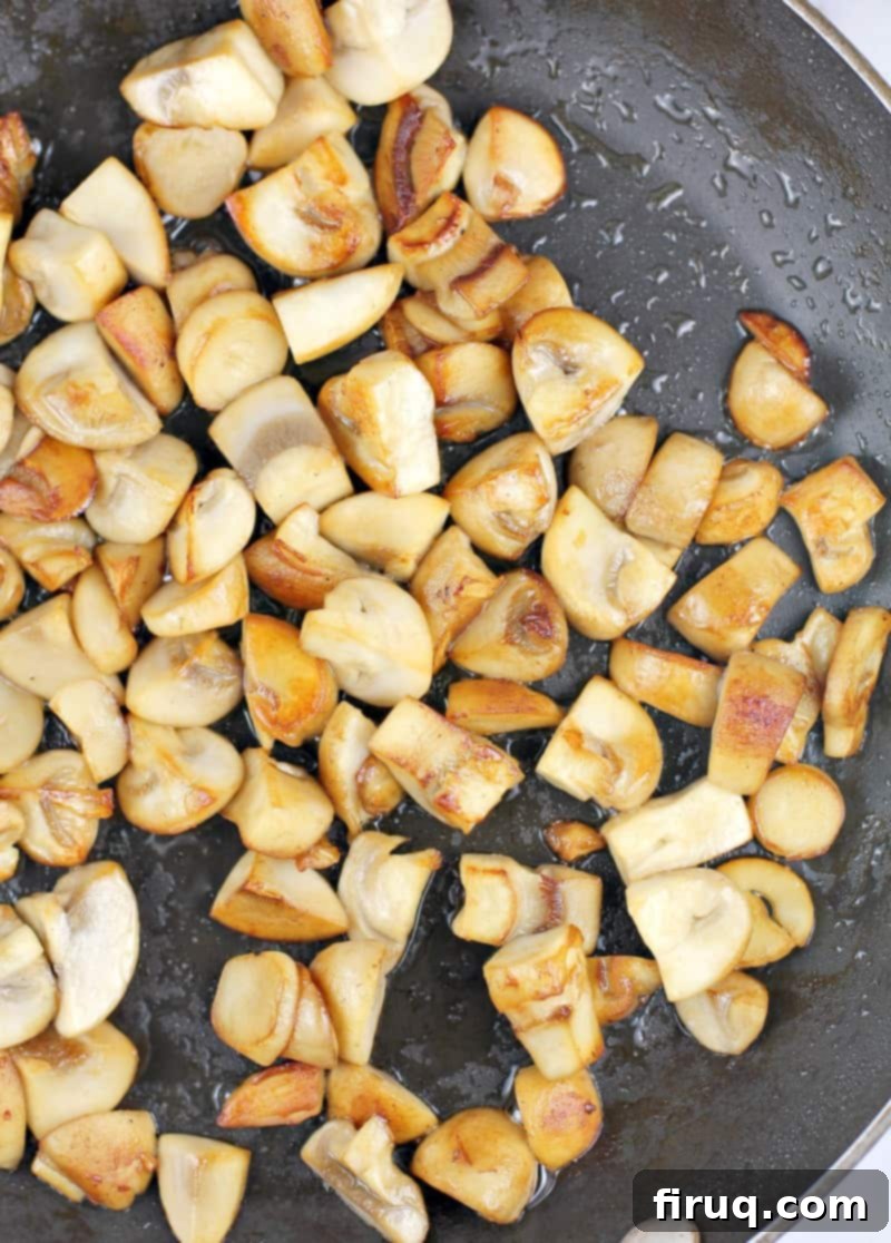 Christmas Morning Croissant Bake 6 browned mushrooms in skillet
