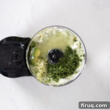 Vibrant Avocado Lime Sauce 7 cilantro, garlic, and lime juice added to the food processor.