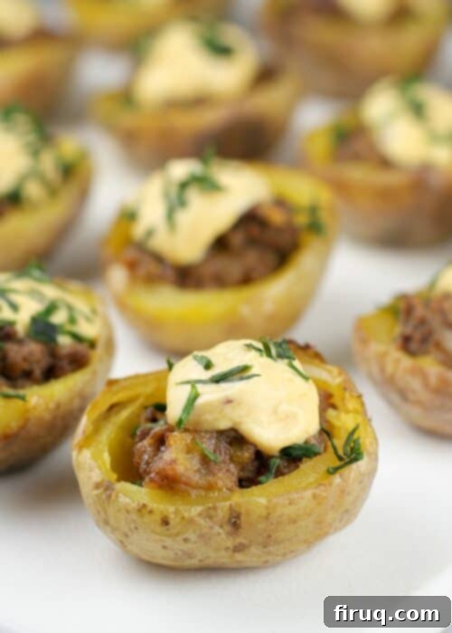 Crispy Cheeseburger Potato Poppers 2 Crispy Mini Cheeseburger Potato Bites with Dean's Cheddar Bacon Dip on a platter