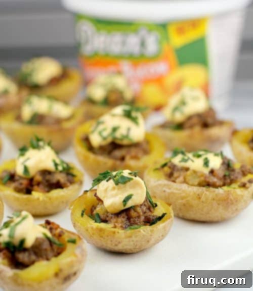 Crispy Cheeseburger Potato Poppers 3 Close-up of Mini Cheeseburger Potato Bites topped with creamy Dean's Cheddar Bacon Dip