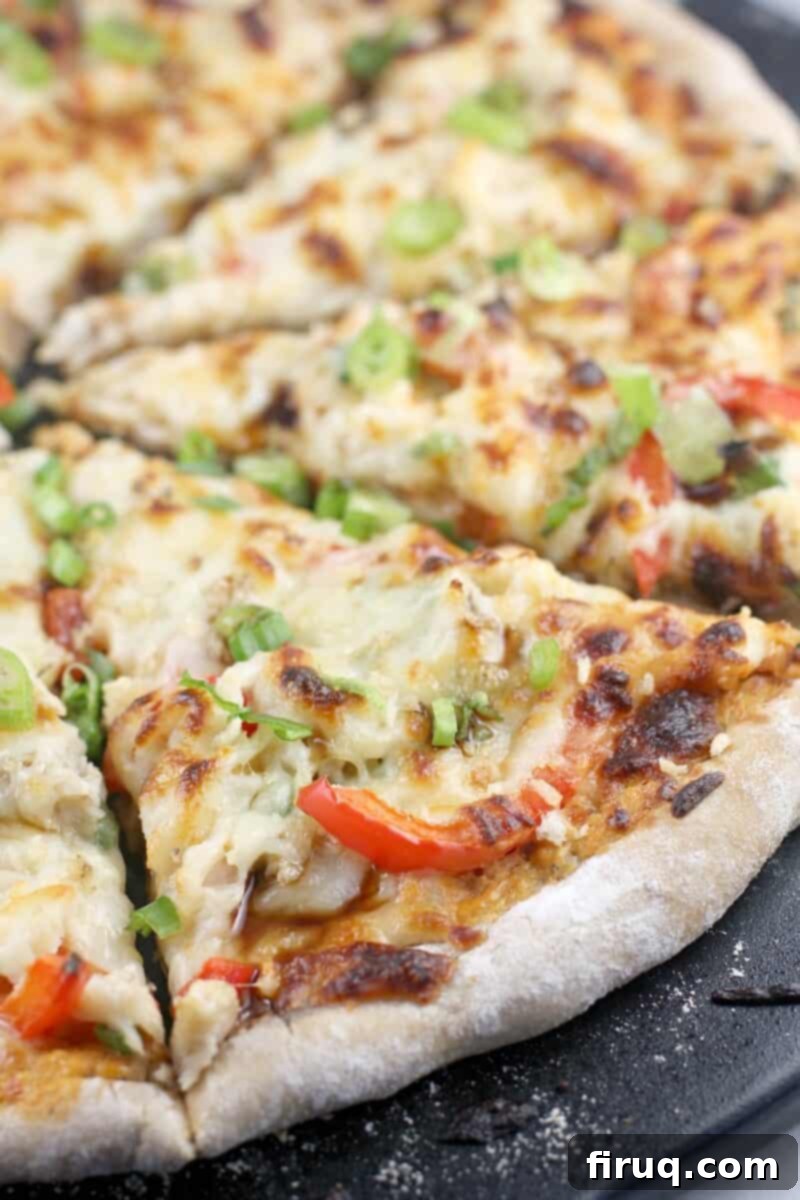 Creamy Crab Rangoon Pizza 4 close side view of cooked sliced pizza