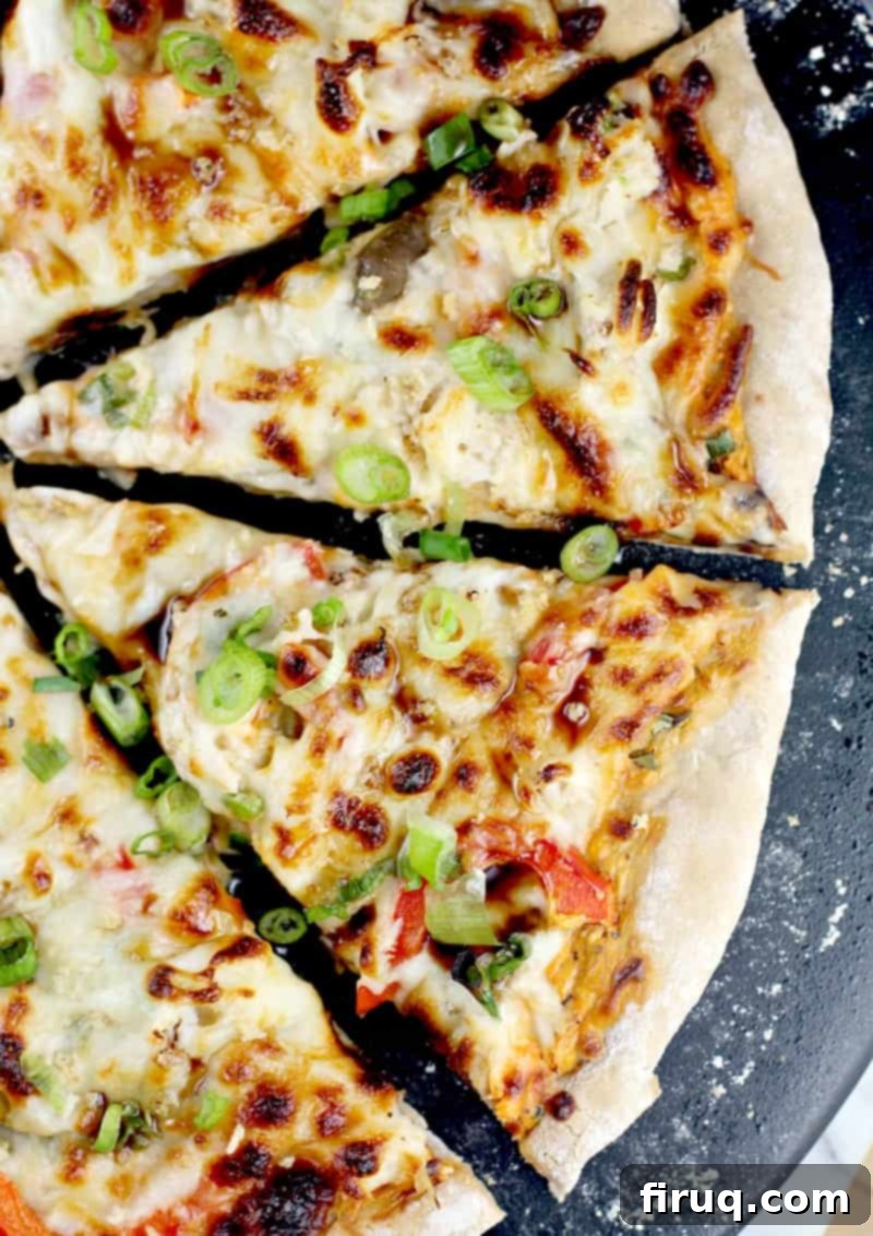Creamy Crab Rangoon Pizza 5 sliced pizza topped with chopped green onion