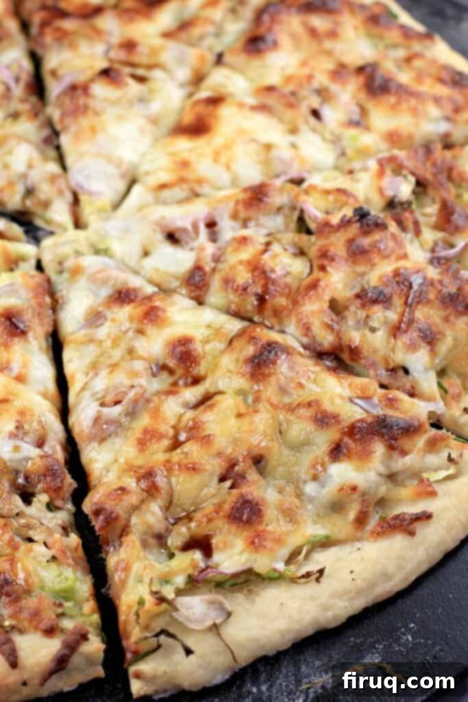 Creamy Crab Rangoon Pizza 6 sliced pizza on pizza stone